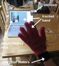 Pilot study that demonstrated that vibrotactile feedback can guide subjects' hands to targets on a screen (July 2009). Photo by Jon Bird.